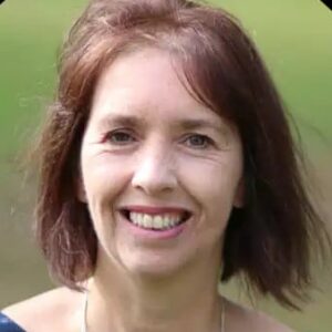Smiling woman with bobbed red-brown hair